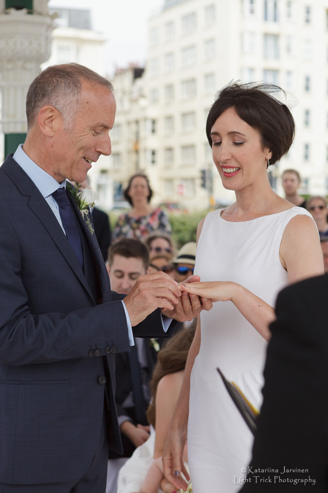 exchange of wedding rings at Brighton Bandstand
